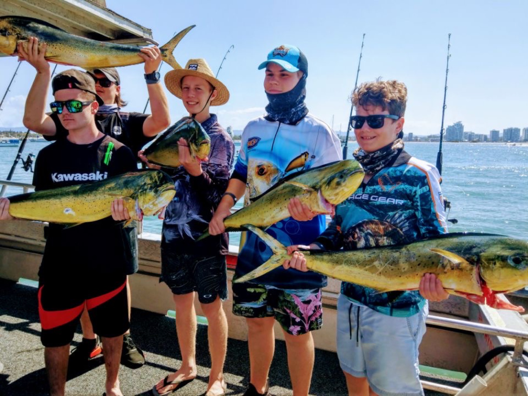 A group of young anglers with a haul of mahi mahi