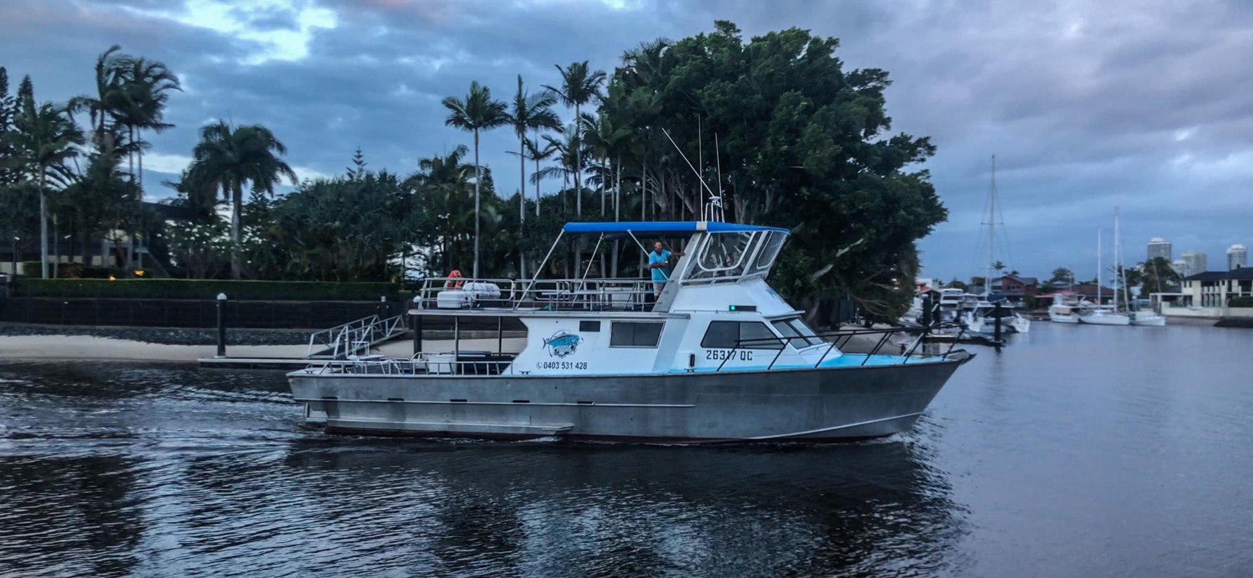 The Paradise Fishing Charters 52 foot Westcoaster heading out through the Broadwater